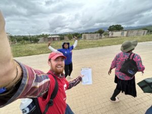 Mac in a selfie with 2 friends.