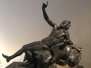 A sculpture of a drunken satyr